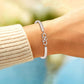 POUR MA FILLE ADOPTIVE - BRILLE TOUJOURS COMME L'ÉTOILE LA PLUS BRILLANTE BRACELET INFINITY