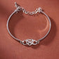 POUR MA FILLE ADOPTIVE - BRILLE TOUJOURS COMME L'ÉTOILE LA PLUS BRILLANTE BRACELET INFINITY