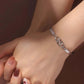 POUR MA FILLE ADOPTIVE - BRILLE TOUJOURS COMME L'ÉTOILE LA PLUS BRILLANTE BRACELET INFINITY